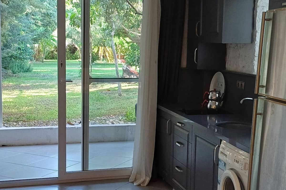 club triple room, garden view | private kitchen | full-sized fridge, dining tables