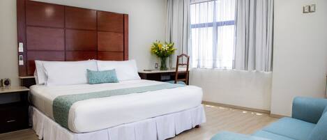 Junior Studio Suite | Minibar, in-room safe, desk, iron/ironing board