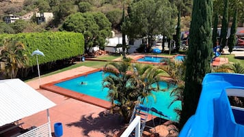 Outdoor pool, open 9:00 AM to 6:00 PM, pool loungers