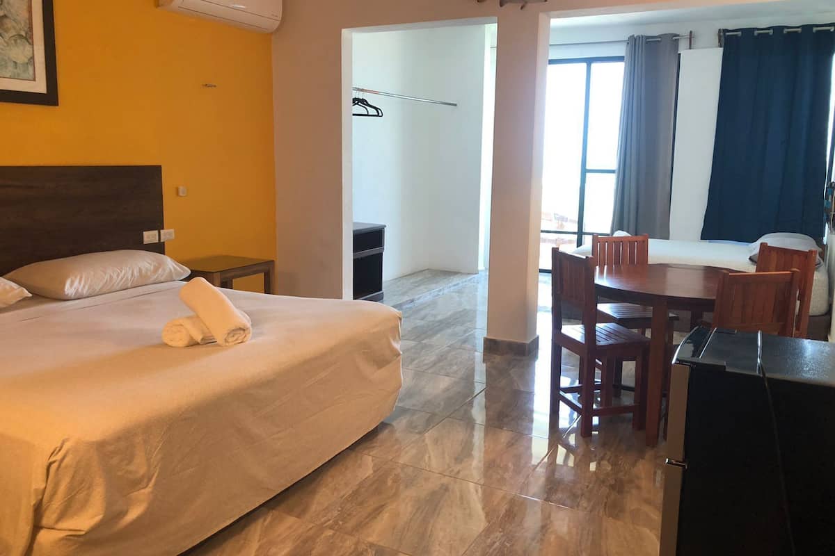 Family Quadruple Room | Laptop workspace, blackout drapes, WiFi (free), individually decorated
