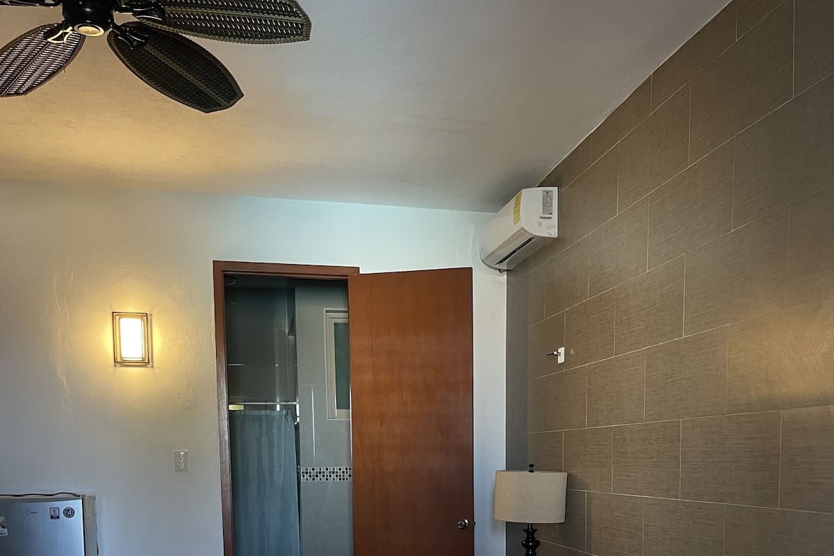 Traditional Double Room, 1 Bedroom, Partial Ocean View | Laptop workspace, blackout drapes, WiFi (free), individually decorated
