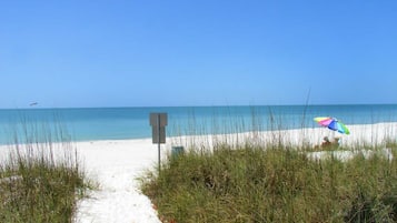 On the beach, sun loungers, beach towels