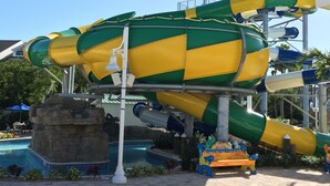 A water park with a large, colorful water slide.