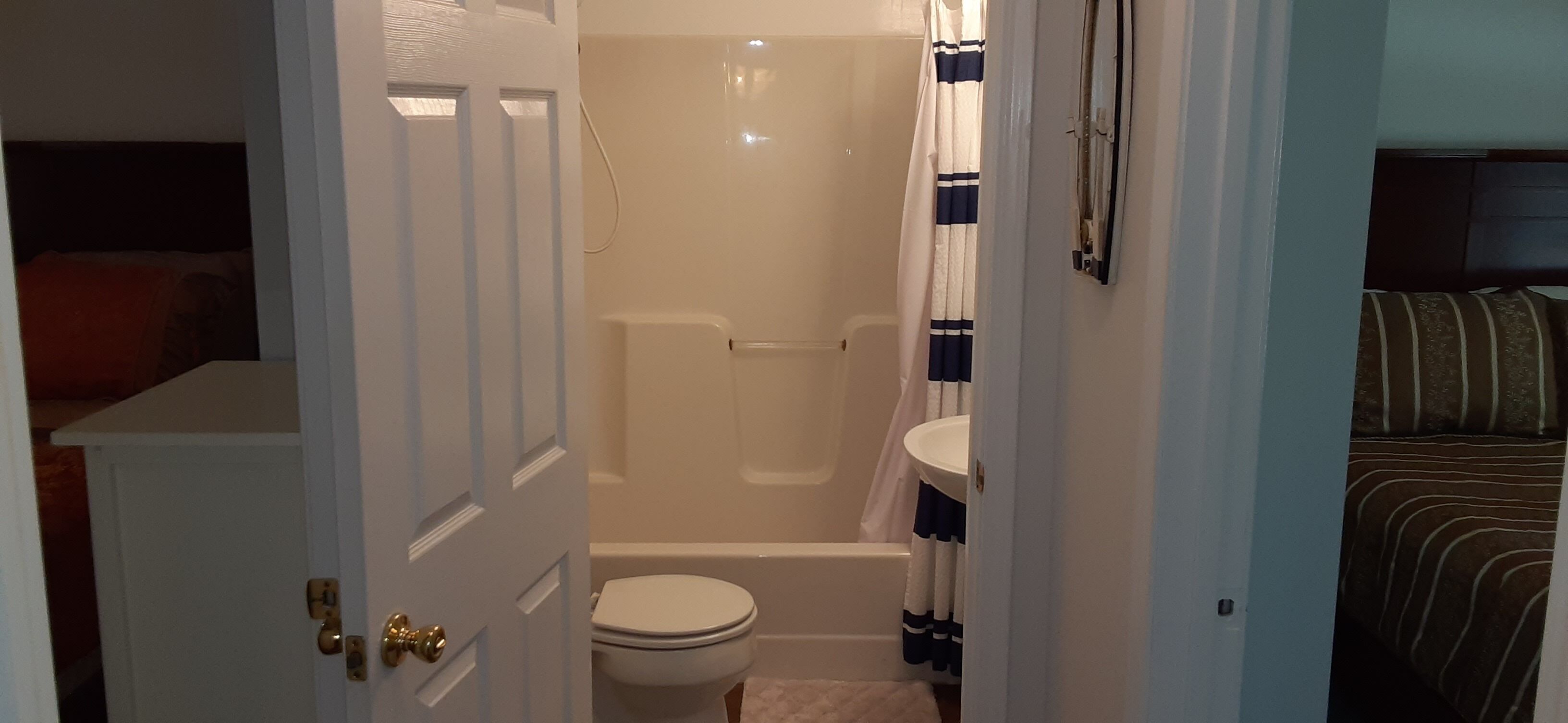 Combined shower/bathtub, towels, toilet paper