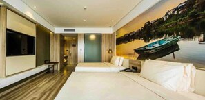 A modern hotel room with a large bed, a flat-screen TV, a painting of a lake, and a wooden floor. - Atour Hotel People's Square Xiaoshan Hangzhou (Hangzhou)