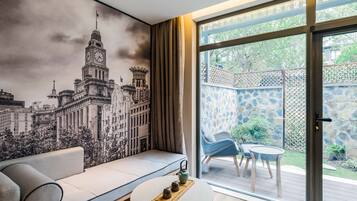 Family Twin Room | Living room | Flat-screen TV