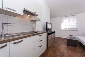 Fridge, microwave, stovetop, coffee/tea maker