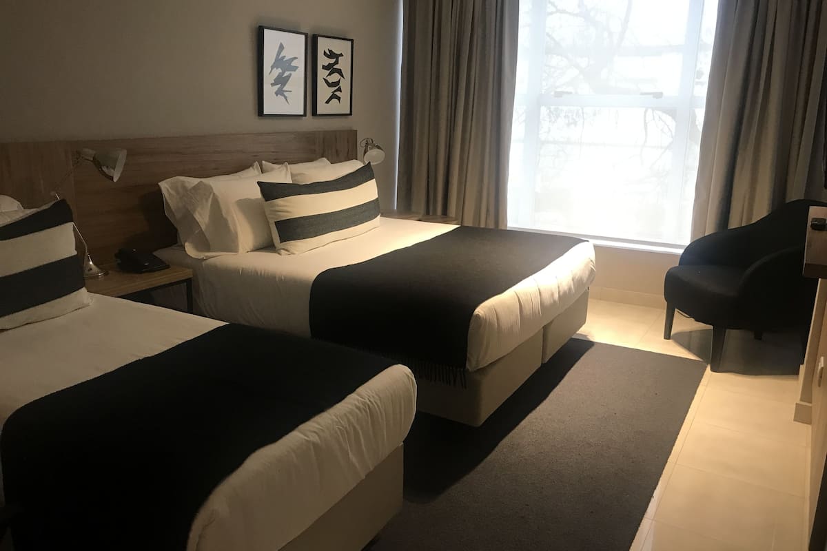 superior triple room, multiple beds | city view