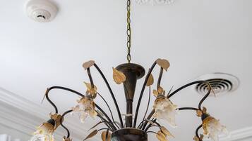 A chandelier with multiple light fixtures and a decorative ceiling medallion.