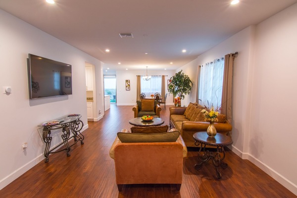 Living Room leading to Dining Area and Kitchen