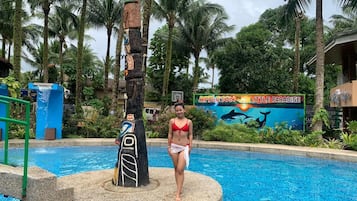 Outdoor pool, open 6:00 AM to 10:00 PM, pool loungers