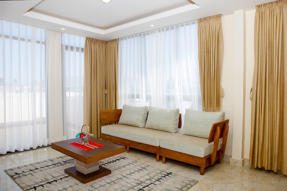 1 BHK Suit Apartment | Living area | 32-inch LED TV with cable channels, TV, DVD player