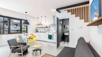 Deluxe Apartment | Living room | 43-inch Smart TV with digital channels, TV, Netflix