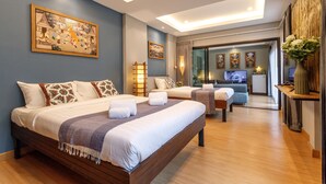 A modern hotel room with a large bed, a desk, and a TV. - Hostel One Art & Gallery (Chiang Mai)