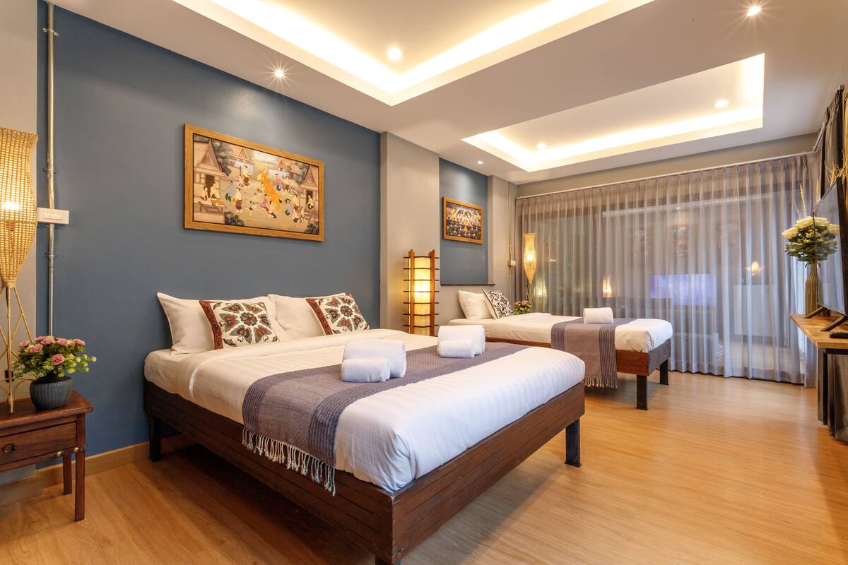 Deluxe Triple Room, Garden View | 1 bedroom, desk, laptop workspace, blackout drapes