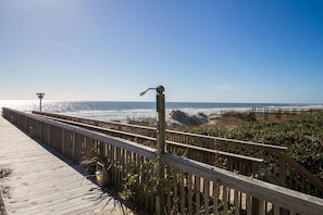 Walk along the boardwalk to the ocean and enjoy the view of the sandy dunes.