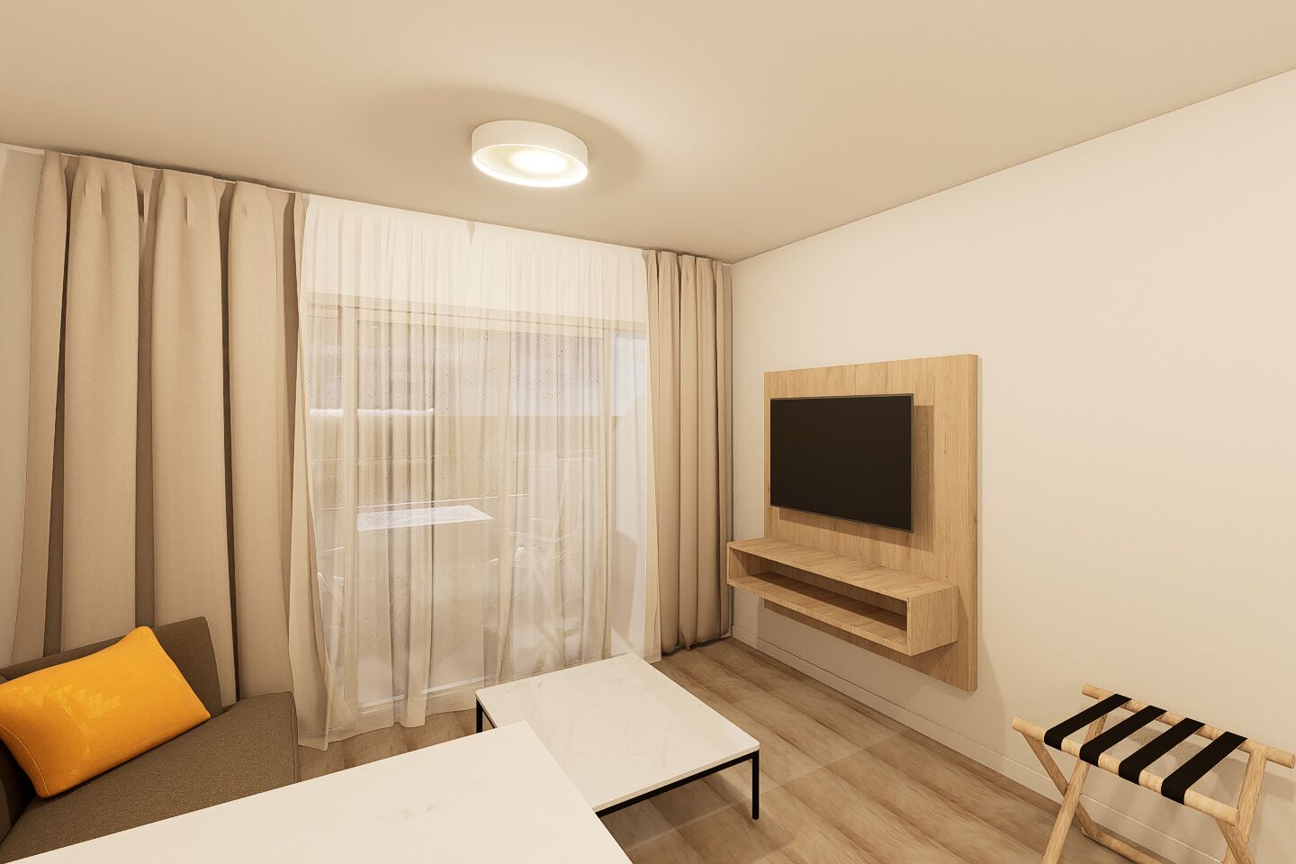 A modern hotel room with a flat-screen TV mounted on a wooden panel, a bed with a yellow pillow, a small table, and a window with sheer curtains.