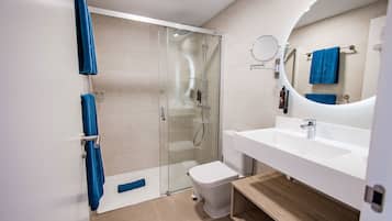 Shower, hair dryer, towels, toilet paper