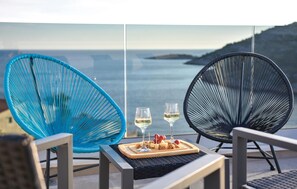 Relax on the terrace with a scenic sea view, where you can enjoy a glass of wine and a selection of snacks.