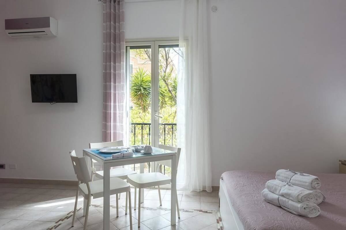 Standard Apartment, 1 Queen Bed with Sofa bed, Courtyard View | In-room safe, individually decorated, blackout drapes, soundproofing