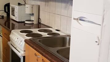 Apartment, City View | Private kitchen | Full-size fridge, microwave, oven, stovetop