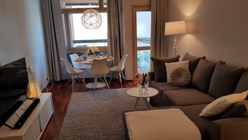 Deluxe Apartment (with Sauna and Balcony) | Living area | Flat-screen TV