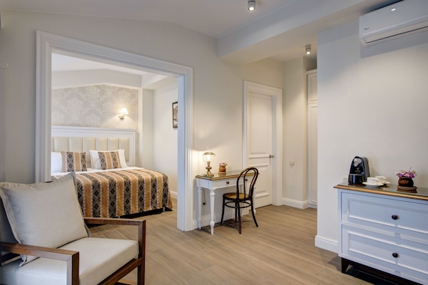 Junior Suite, City View | 1 bedroom, premium bedding, minibar, in-room safe