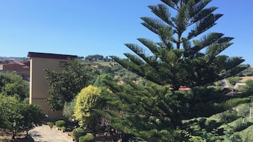 Stroll through the serene garden, surrounded by lush trees and shrubs, and enjoy the tranquil atmosphere.