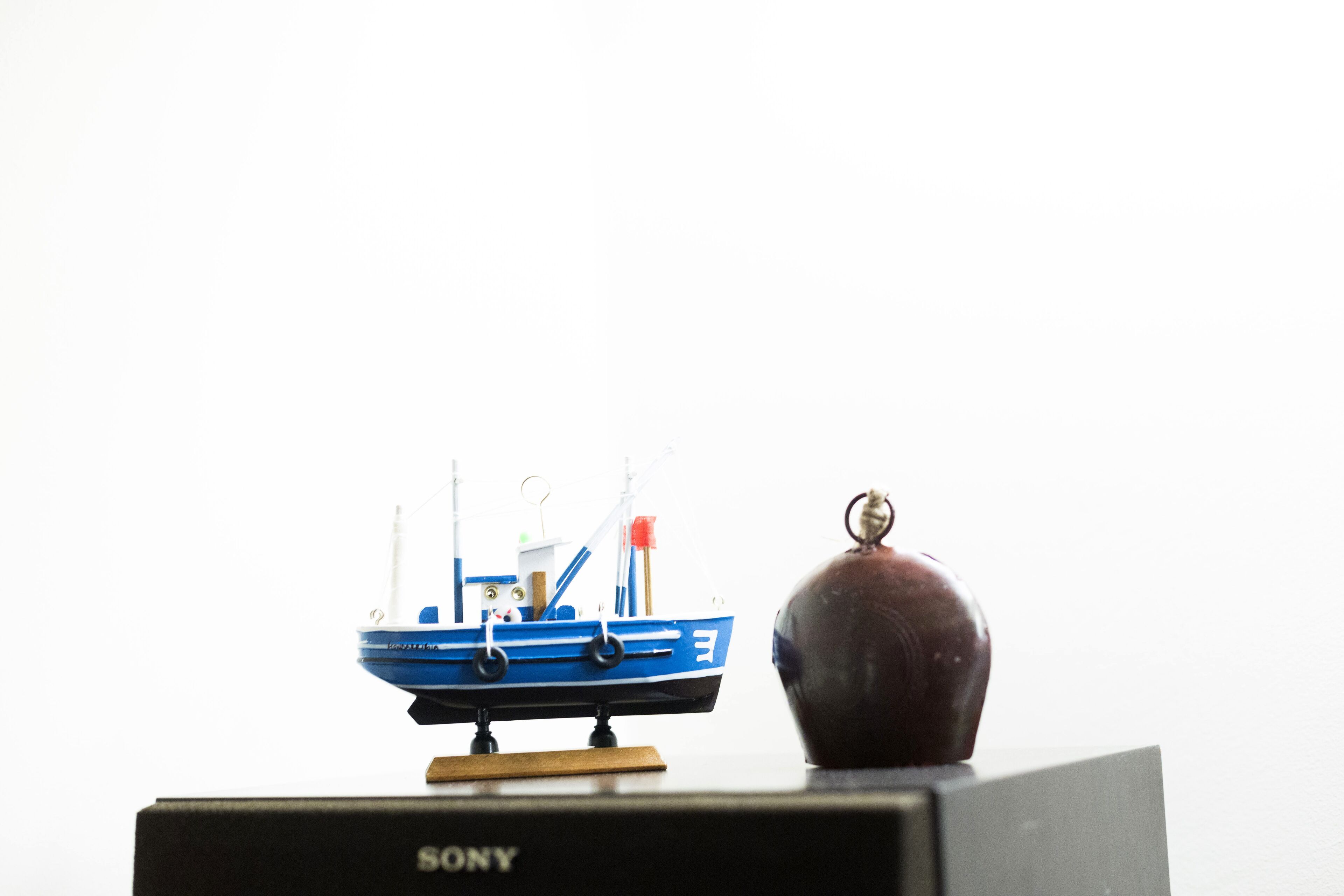 A model boat on a Sony branded box.