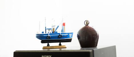 A model boat on a Sony branded box.