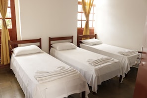 Standard Apartment, 3 Twin Beds, Private Bathroom | Blackout drapes, bed sheets