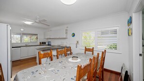 Enjoy meals in this kitchen with microwave, refrigerator, and dining area.