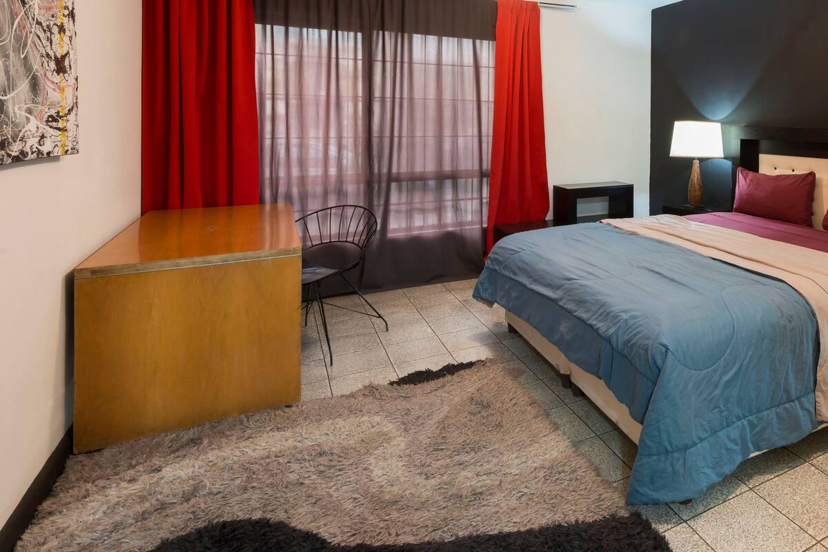Economy Room, 1 King Bed | Down comforters, desk, laptop workspace, blackout drapes