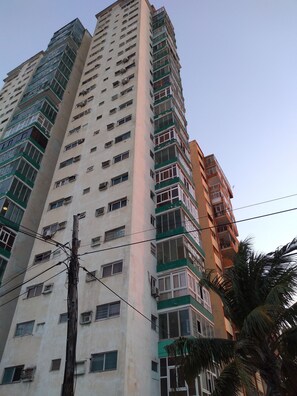 A multi-story building with numerous windows and balconies. - Casa Issi Nelson (Havana)