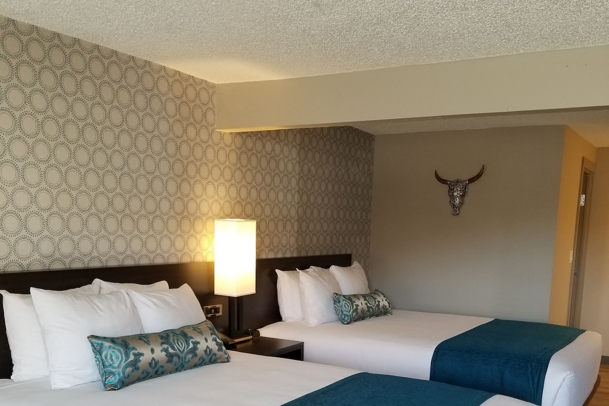 Premium bedding, desk, laptop workspace, blackout curtains