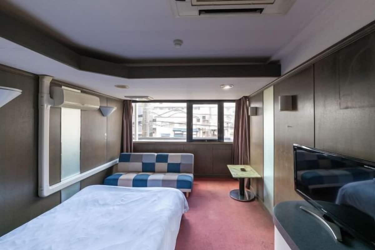 Desk, blackout curtains, free WiFi, bed sheets