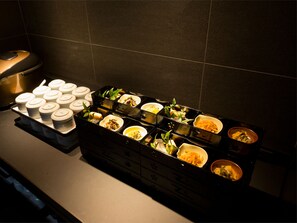 A buffet setup with various dishes and condiments. - The Hotels Hakata Kasane Bayside (Fukuoka)
