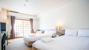 A hotel room with two beds, a desk, a chair, a TV, and an air conditioning unit. - Hakuba Gateway Hotel (Hakuba)