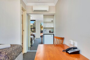 Individually furnished, desk, laptop workspace, rollaway beds