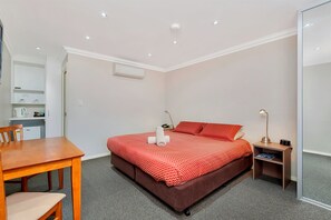 Individually furnished, desk, laptop workspace, rollaway beds