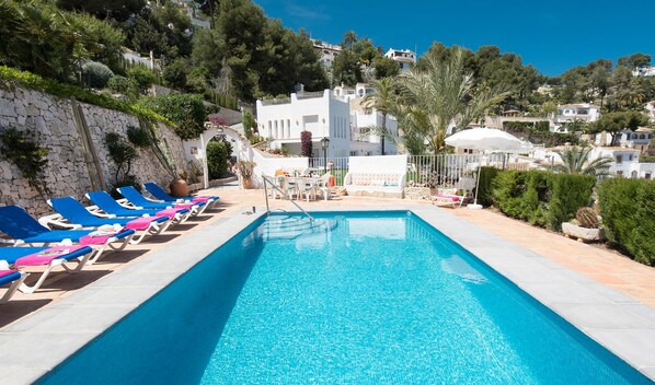 Outdoor pool, pool umbrellas, pool loungers