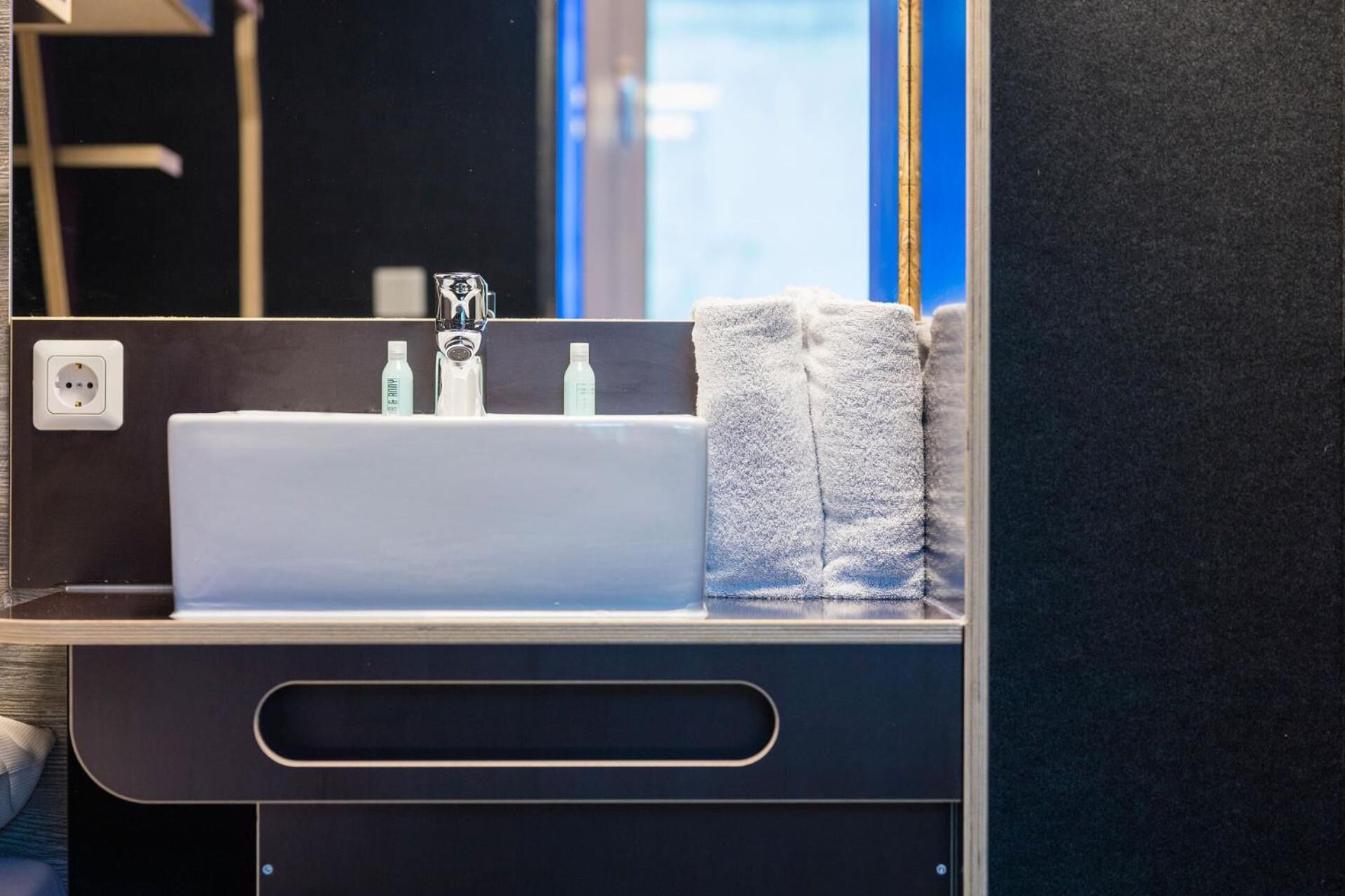 shower, hair dryer, towels, toilet paper