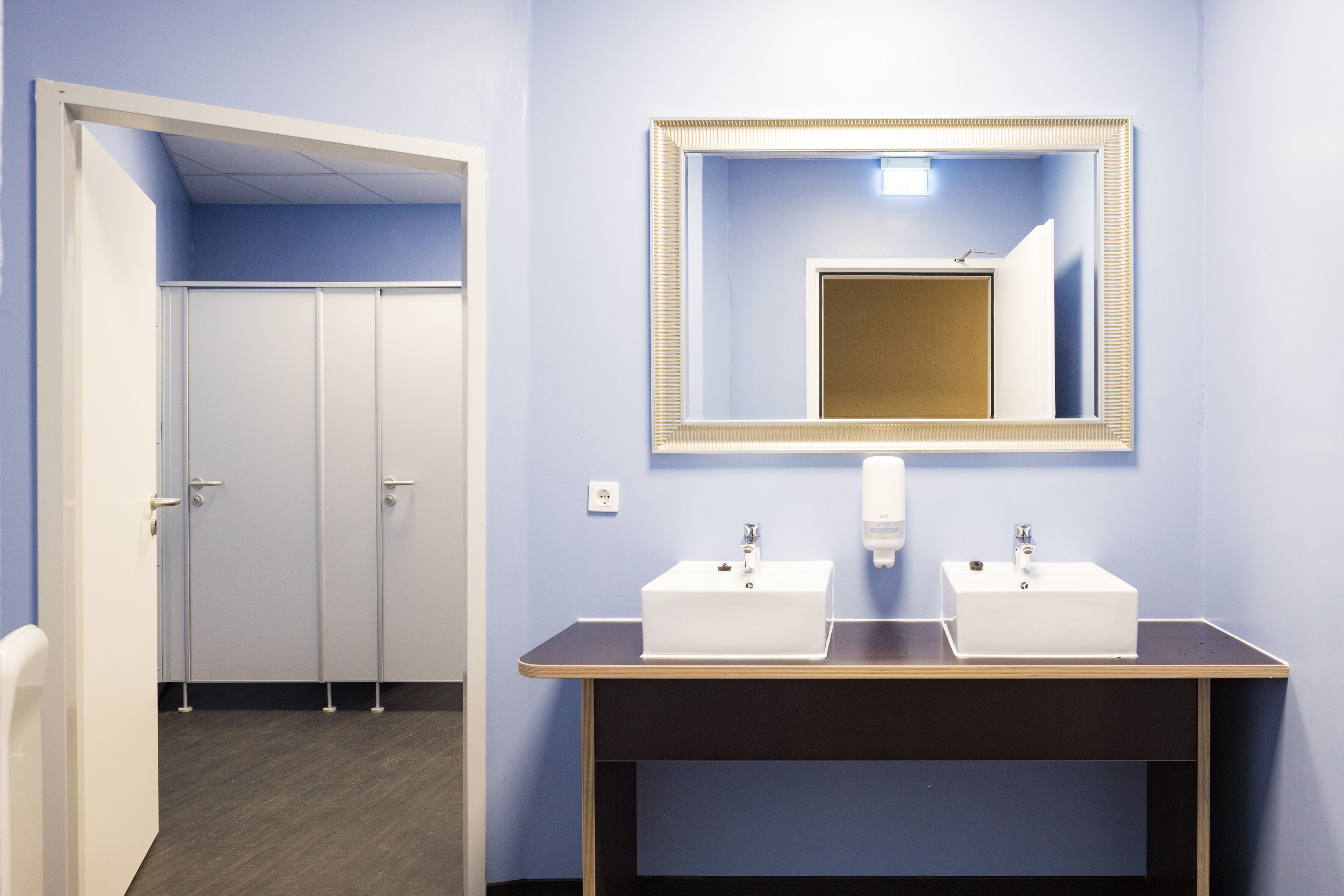 shower, hair dryer, towels, toilet paper