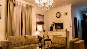 Double or Twin Room | Living area | TV