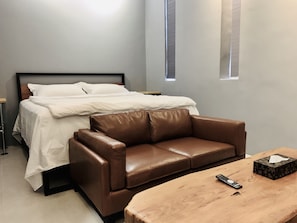 Premium bedding, desk, laptop workspace, blackout curtains
