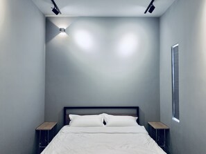 Premium bedding, desk, laptop workspace, blackout curtains