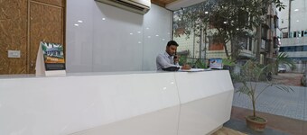 Capital O 7743 Hotel Hiland International