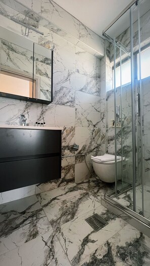 Shower, free toiletries, hair dryer, bathrobes