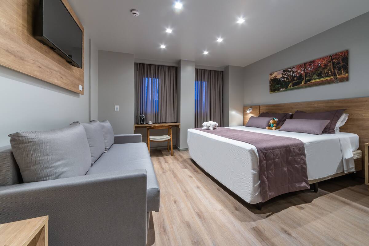 Luxury Triple Room, Multiple Beds | Minibar, in-room safe, desk, laptop workspace