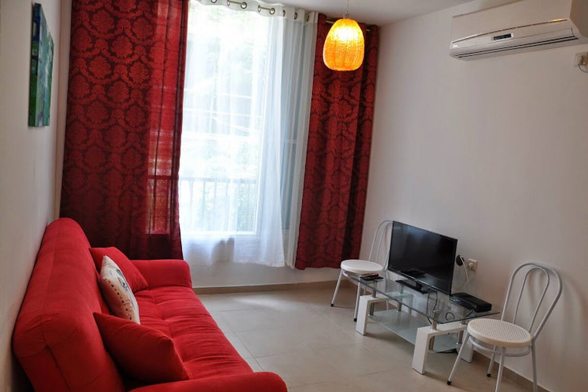 Classic Apartment, 1 Bedroom | Living room | Flat-screen TV